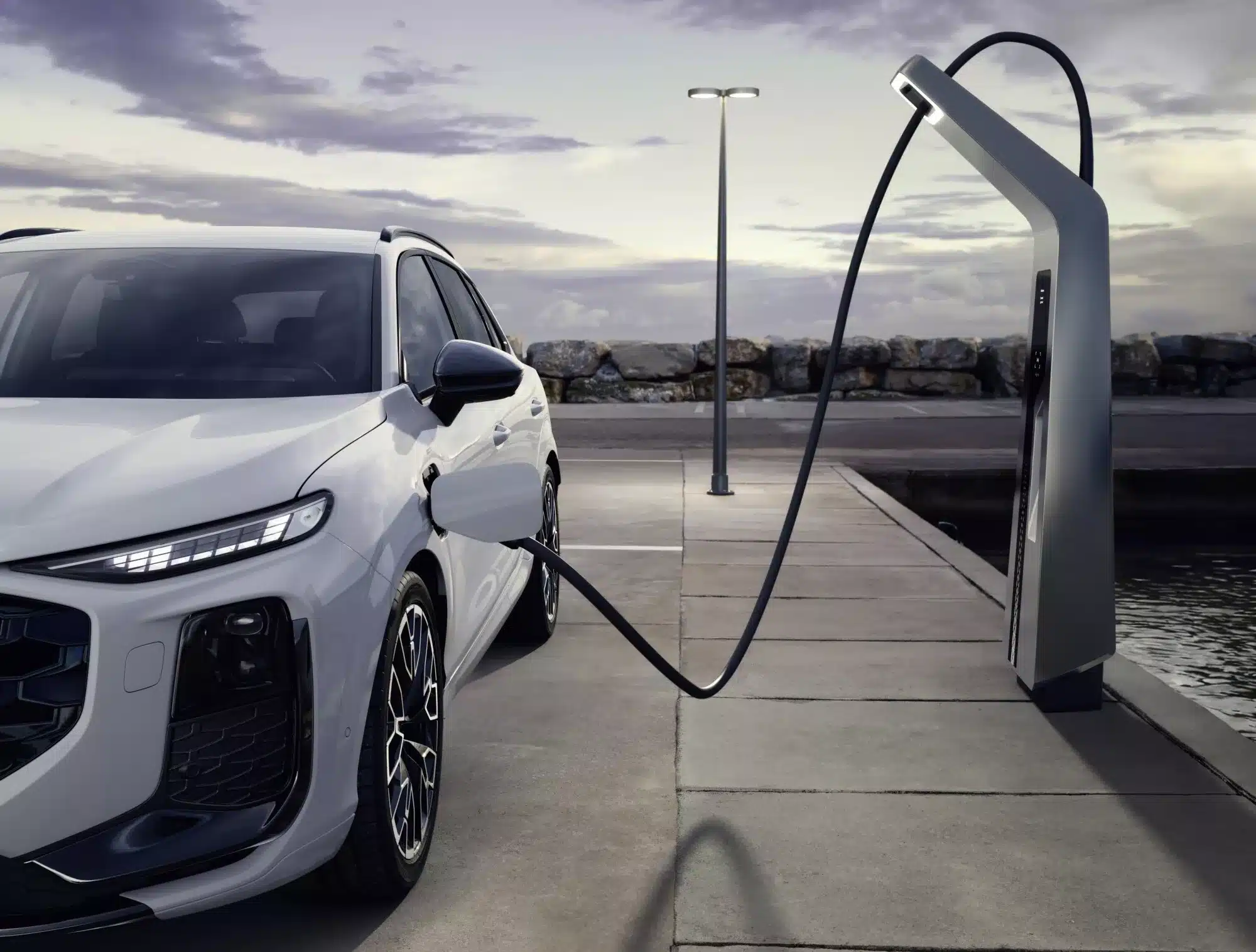 Audi Q3 e-hybrid charging at an electric vehicle charging station